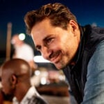 Man leichelt from the side as a symbol for how to attract a man