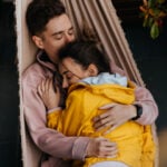 Two soulmates lying together in a hammock.