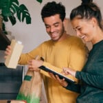 Man and woman cooking together as an example of how to get someone to open up