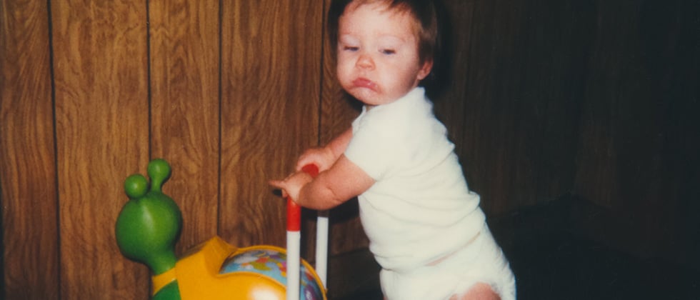 Baby with stroller as a symbol of questions to ask from childhood