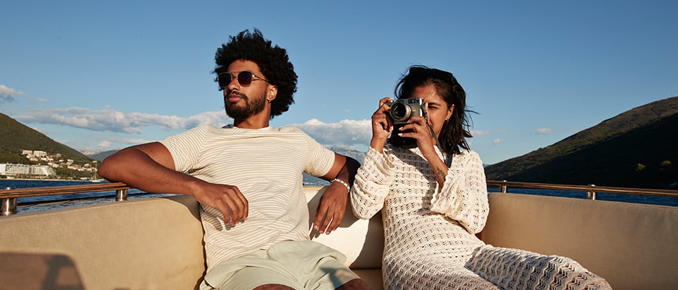 Man and woman on the boat for examples questions to ask about traveling