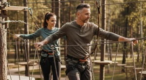 A couple having fun in an advventure park. 
