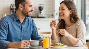 A couple sitting together and enjoying breakfast.