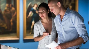 A couple looking at art in a museum.