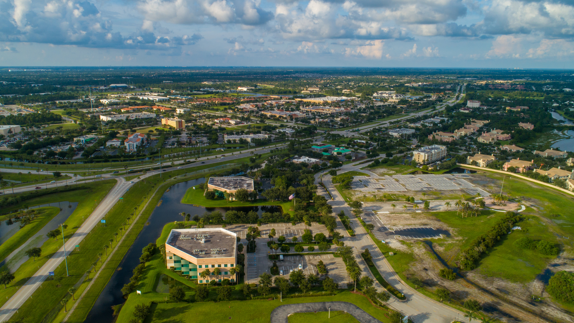 A bird's-eye view of Port St. Lucie, with its green spaces and buildings.